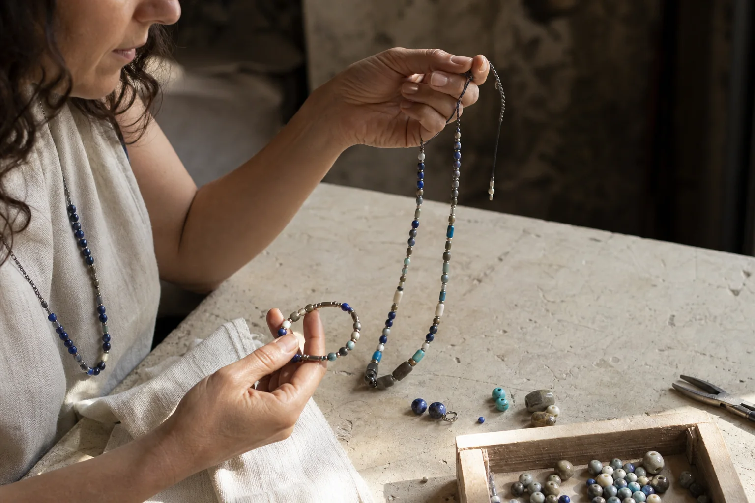 Triballe artisan selecting a handmade natural stone piece
